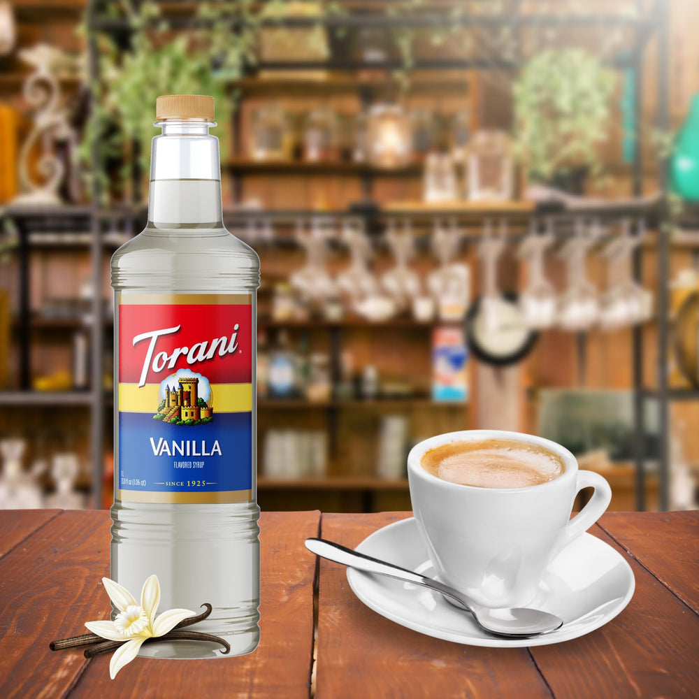 Torani 1L bottle next to a cup for scale showing large volume and value