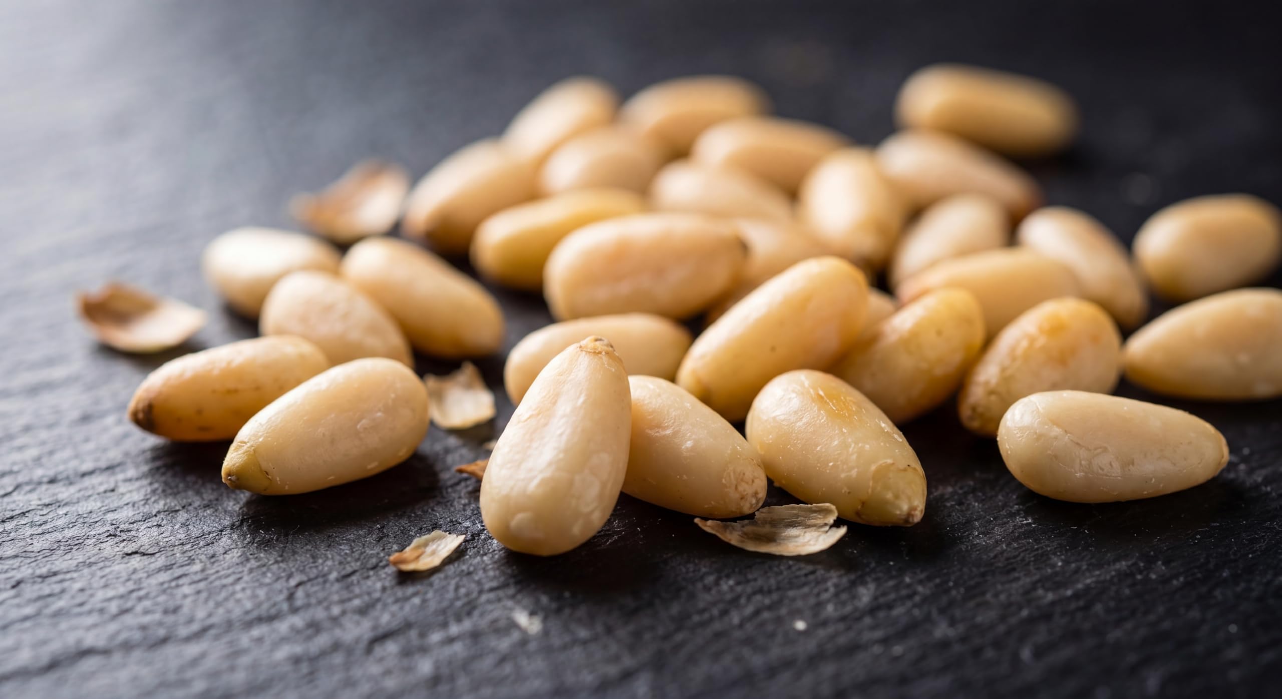 Torre Melissa pine nuts sprinkled on salad adding crunch and flavor