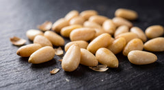 Torre Melissa pine nuts sprinkled on salad adding crunch and flavor