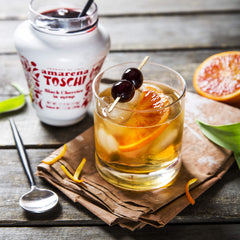 Toschi jar open with syrup and whole cherries, ready-to-use convenience benefit