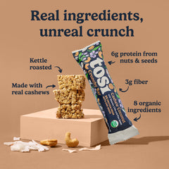 Tosi cashew coconut bar unwrapped top view highlighting crunchy texture and coconut flakes