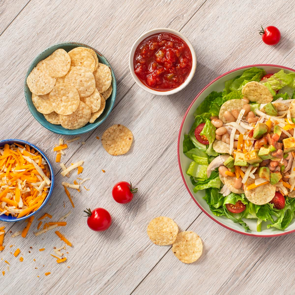 Tostitos four jars stacked in pantry demonstrating bulk supply and value benefit