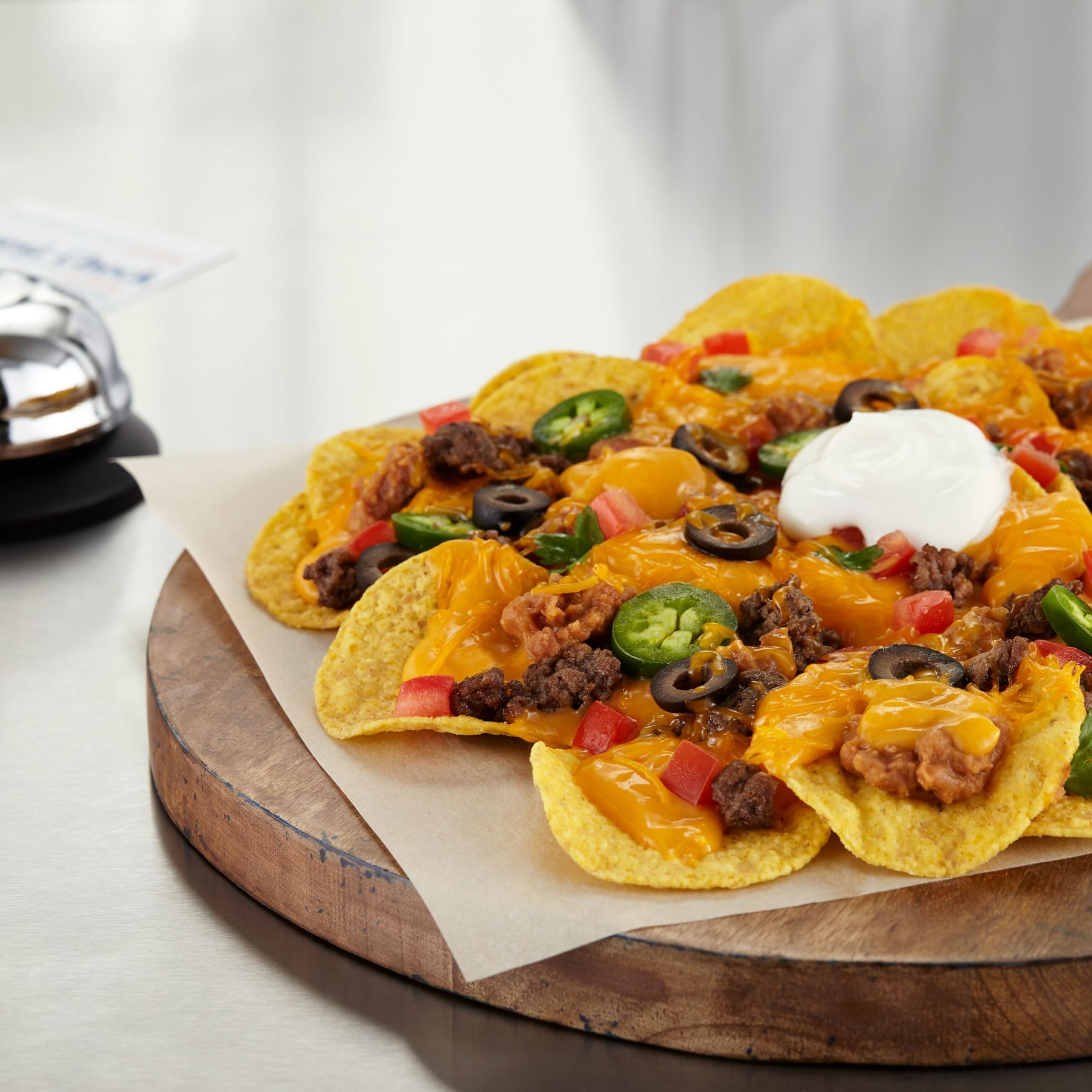 Frito Lay open salsa cup in hand beside chip demonstrating spill-free convenience