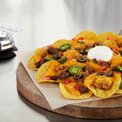 Frito Lay open salsa cup in hand beside chip demonstrating spill-free convenience