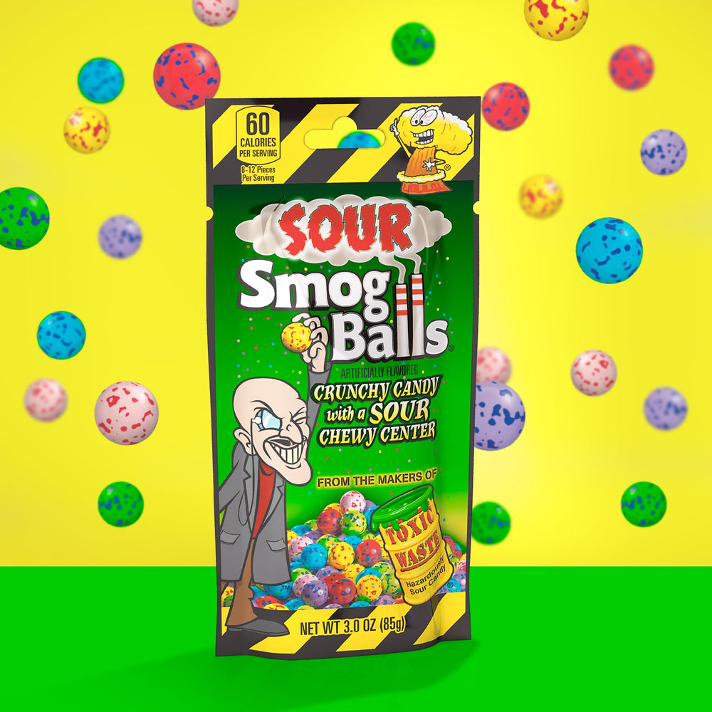 TOXIC WASTE hand holding Smog Ball being eaten to show bite-size enjoyment and convenience