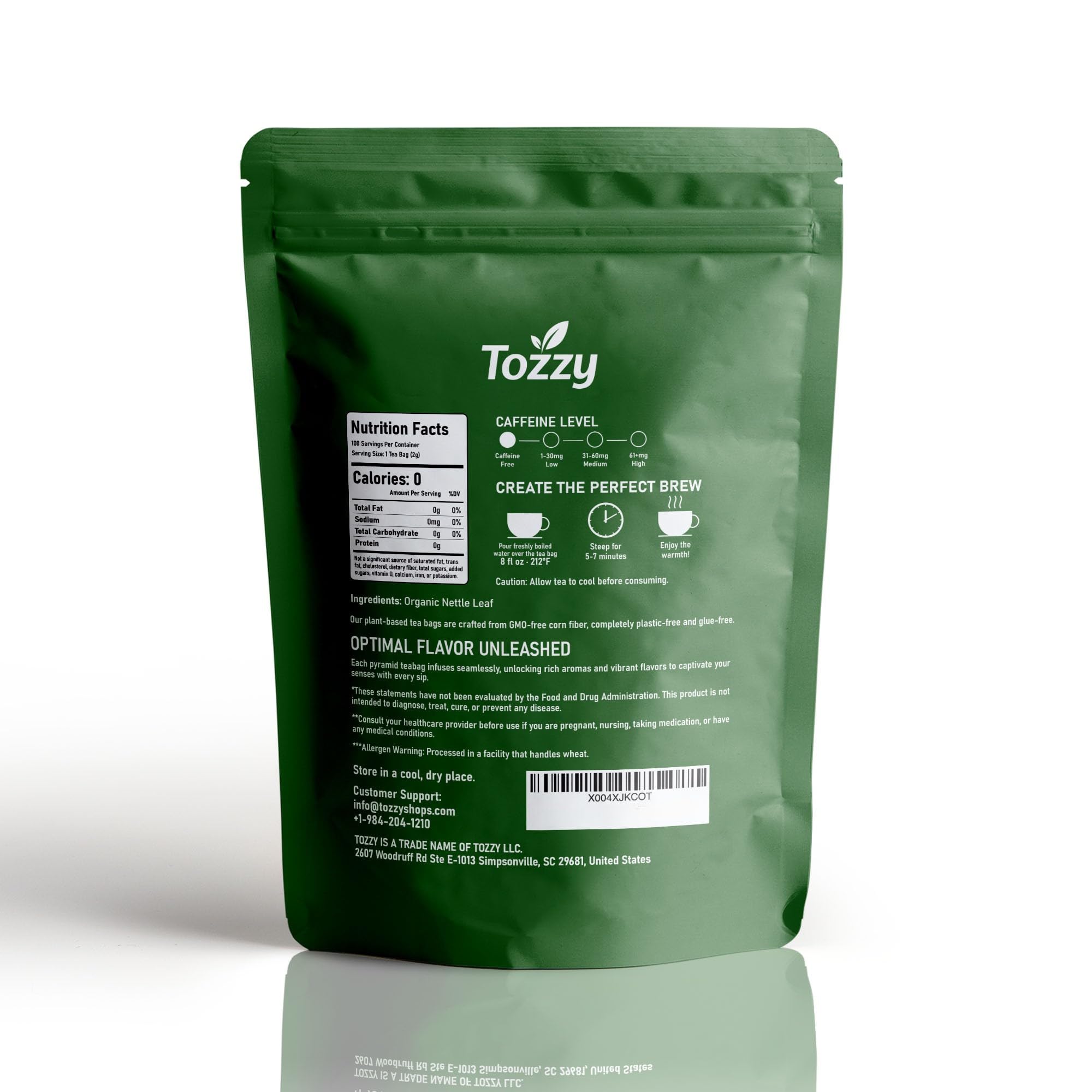 TOZZY pyramid tea bag in hand for scale demonstrating single-serve convenience