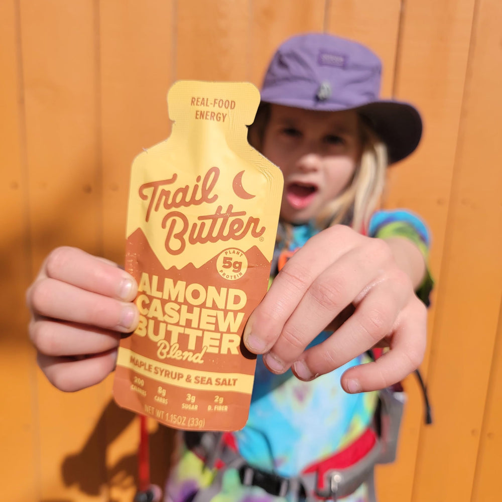 Trail Butter used by hiker on trail showing convenient fueling while active