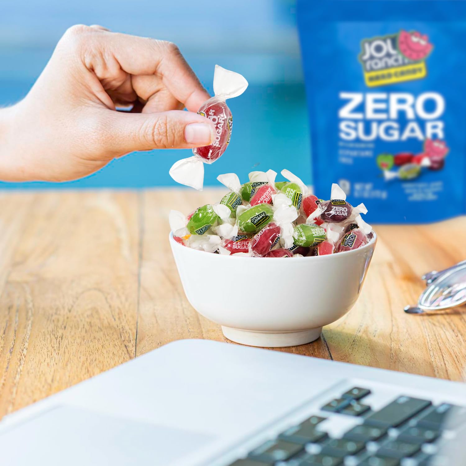 Treatizo candy in hand to show portion size and convenient portable snacking benefits