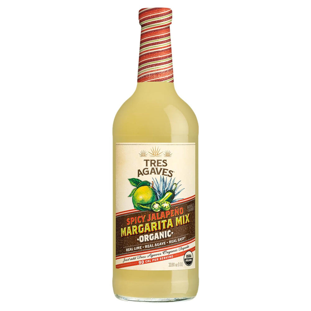 Tres Agaves pouring into glass over ice showing smooth texture and ready-to-serve benefit