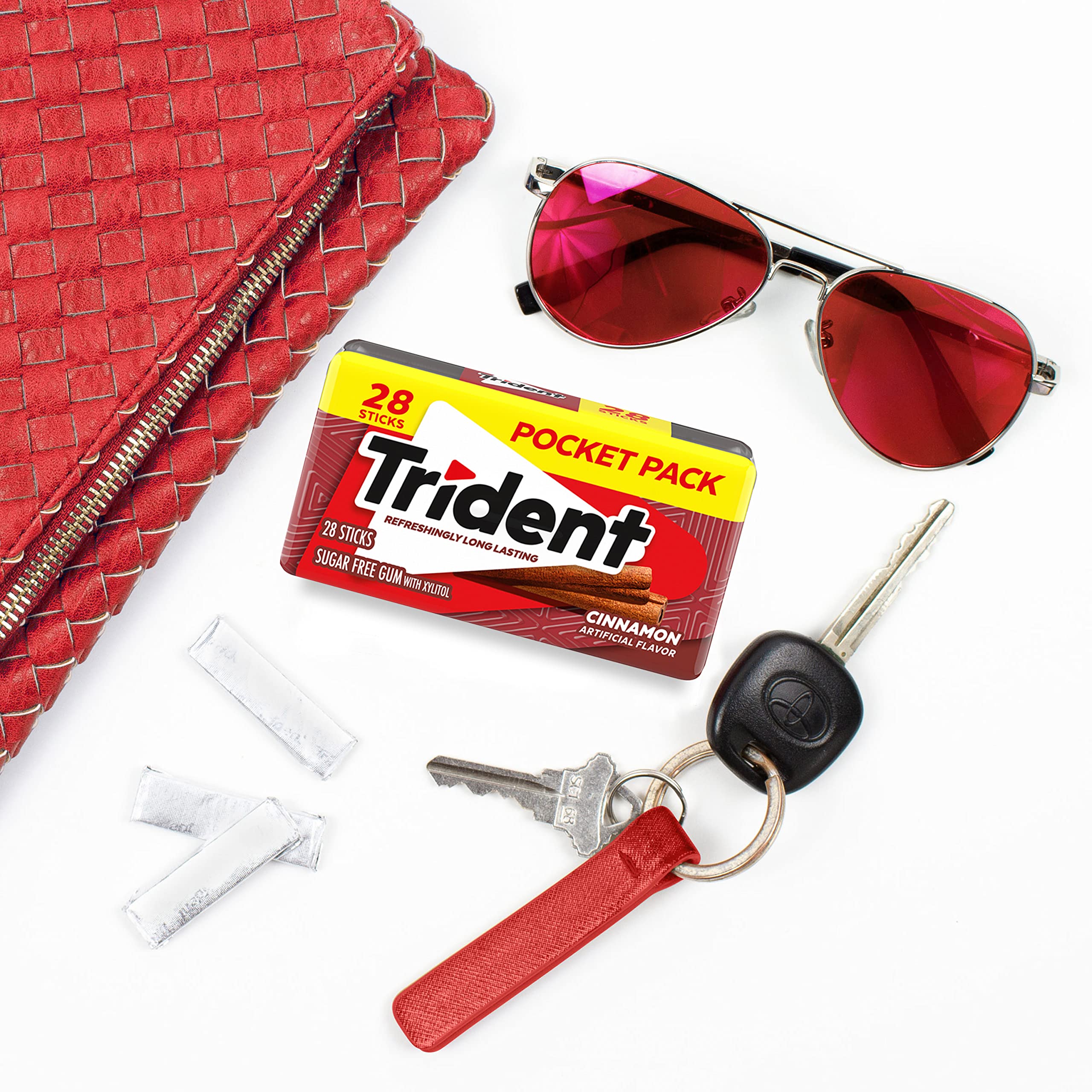 Trident gum sticks held in hand to show scale and convenient portioning for travel