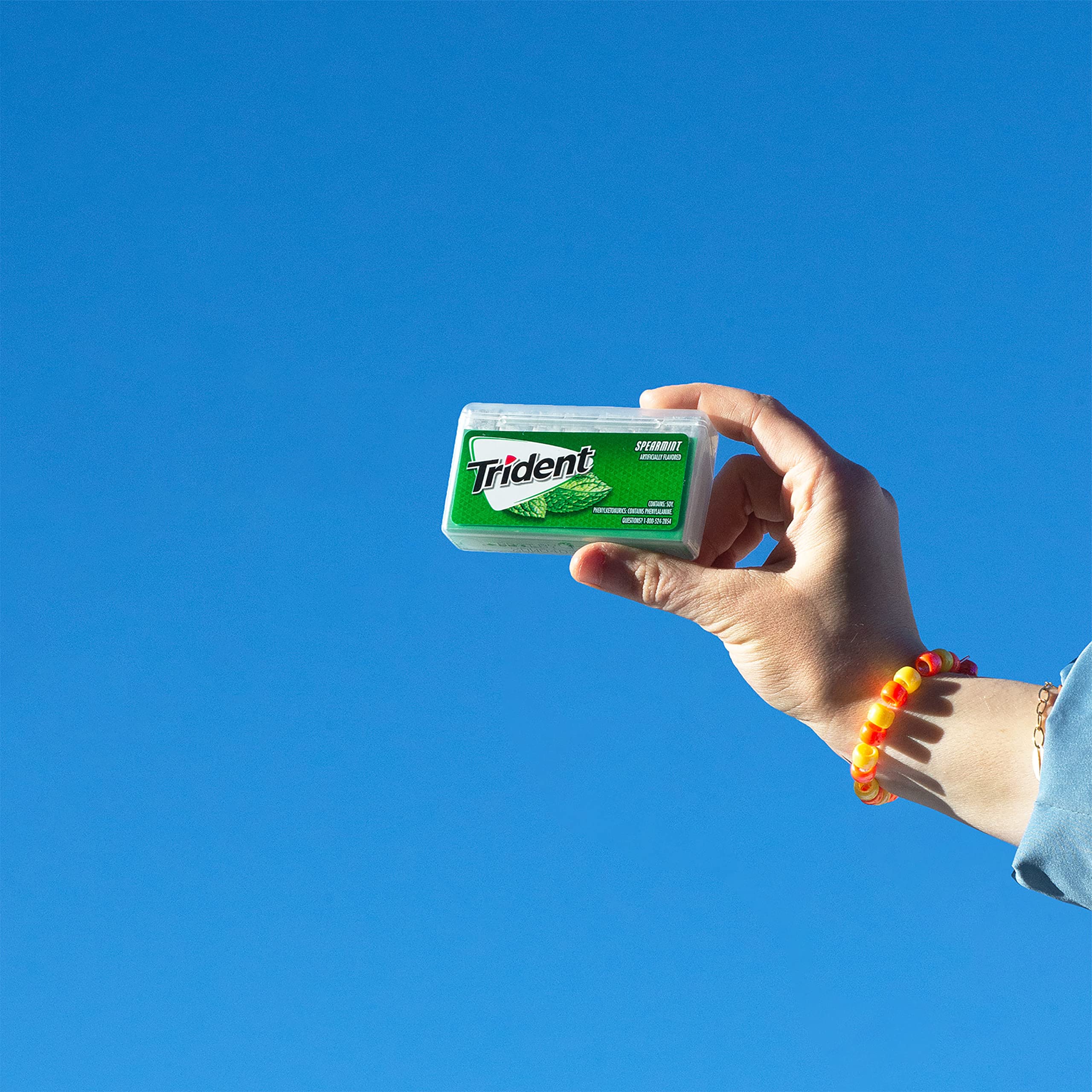 Trident spearmint pocket pack in hand showing compact size for effortless carrying
