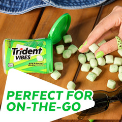 Trident Vibes gum in hand demonstrating one-handed use and quick refresh