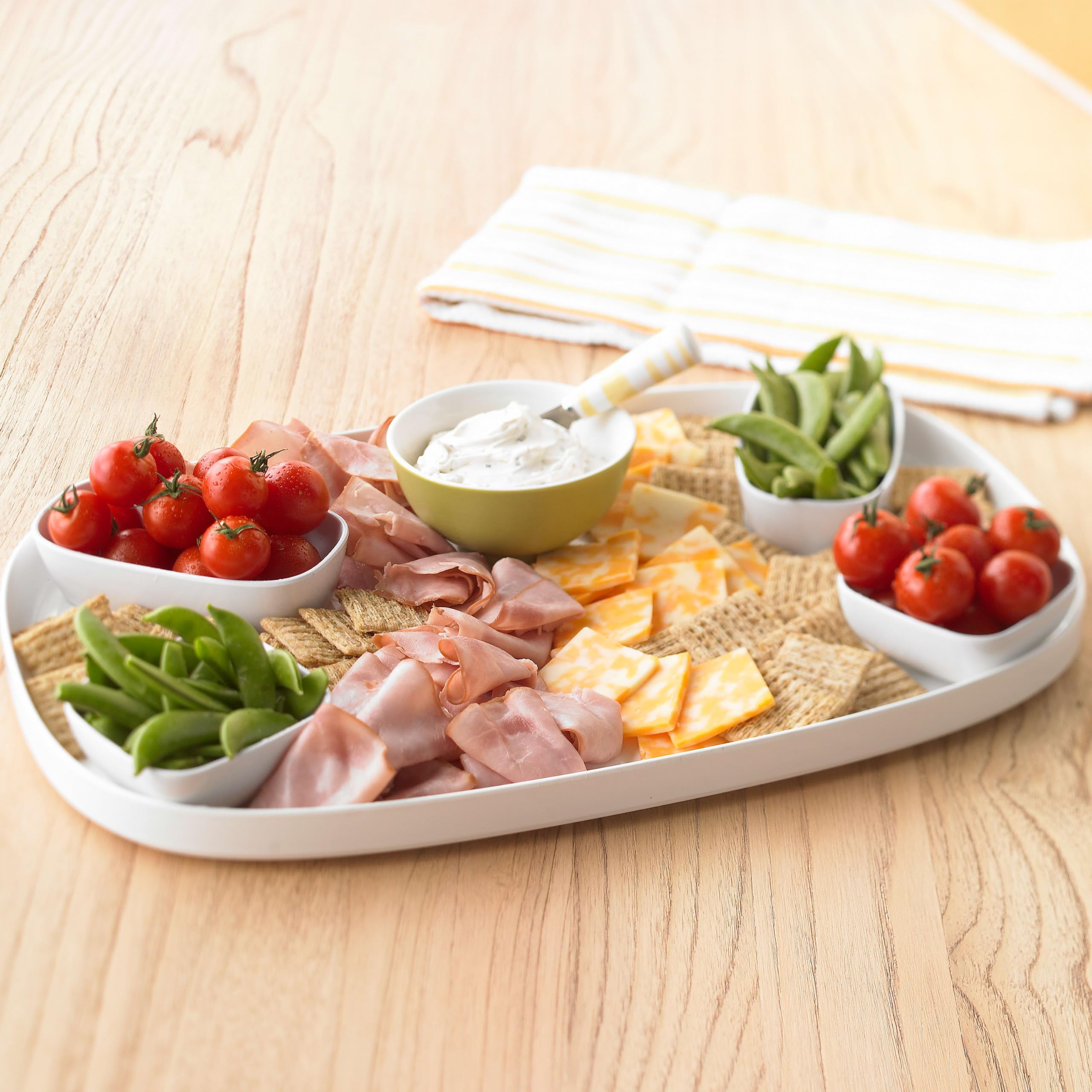 Close-up of Triscuit cracker with spread showing sturdy topping support