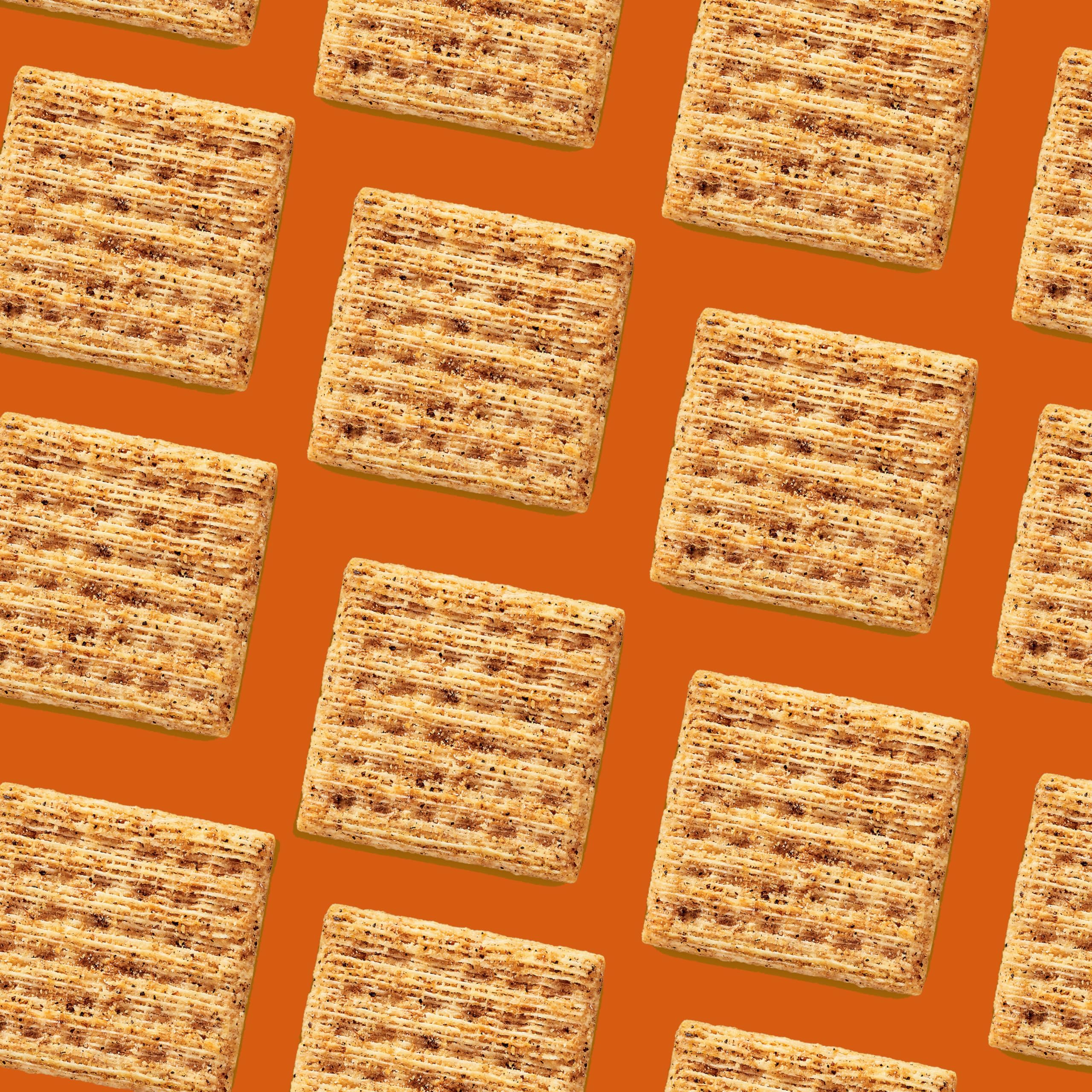 Stack of Triscuit crackers beside a ruler showing size and sturdy bite