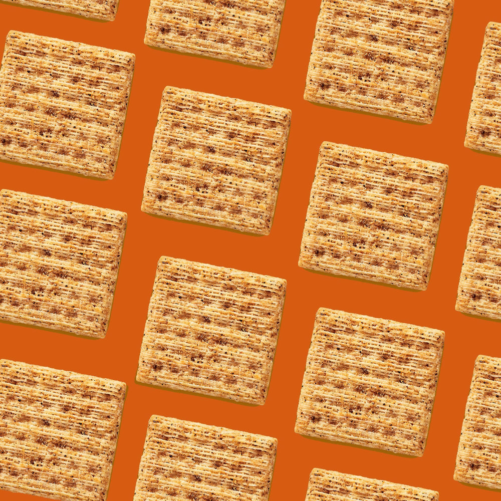 Stack of Triscuit crackers beside a ruler showing size and sturdy bite