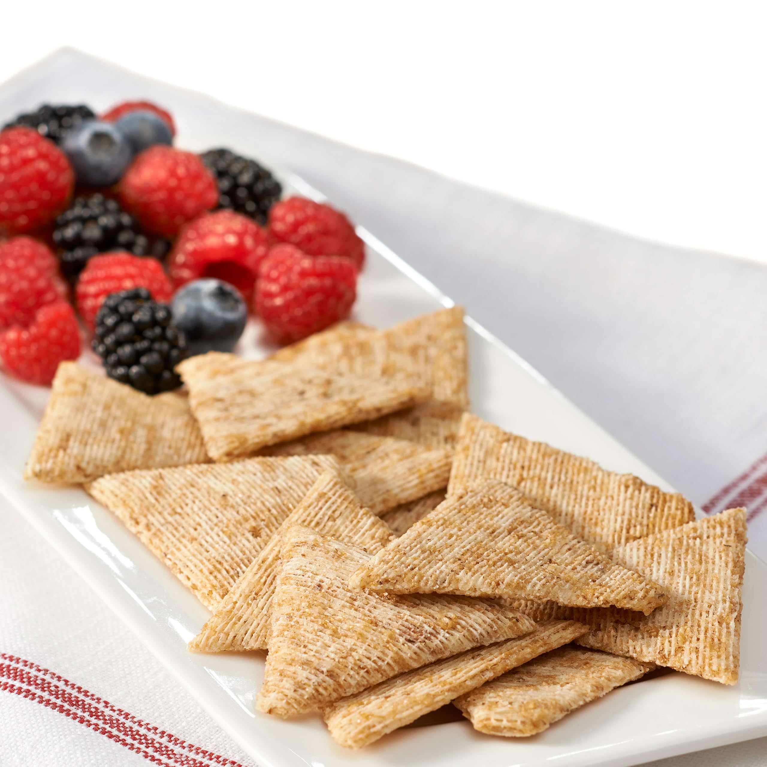 Open Triscuit box with crackers spilling out to illustrate easy access and serving