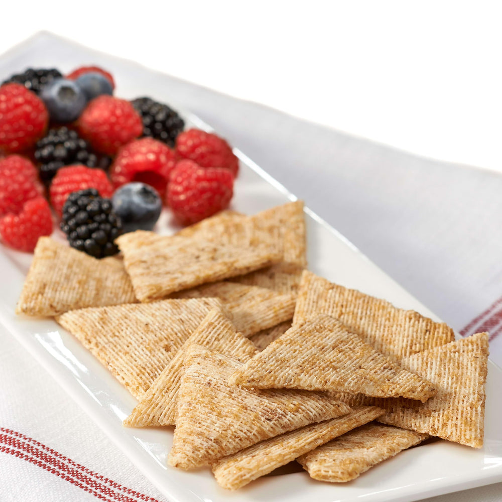 Open Triscuit box with crackers spilling out to illustrate easy access and serving