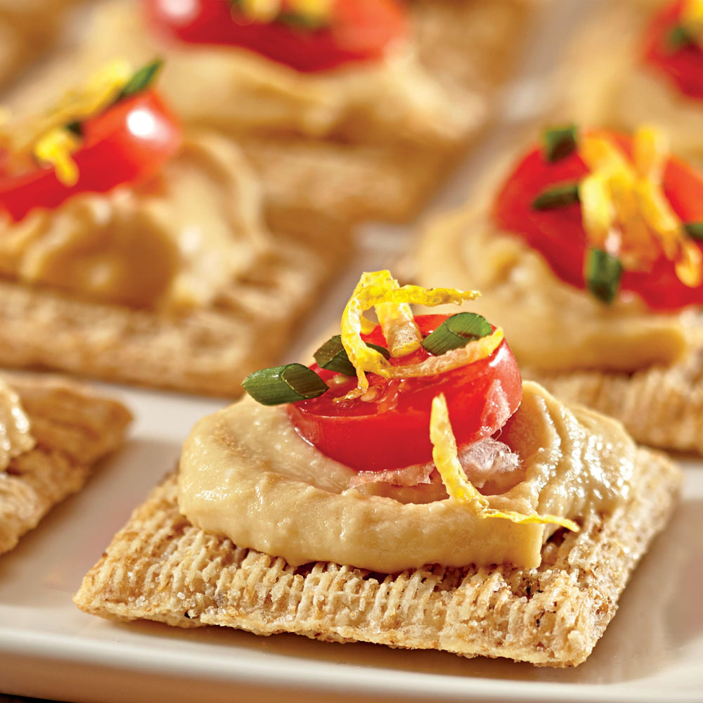 Triscuit open box with stacked crackers preserving fresh crunchy texture