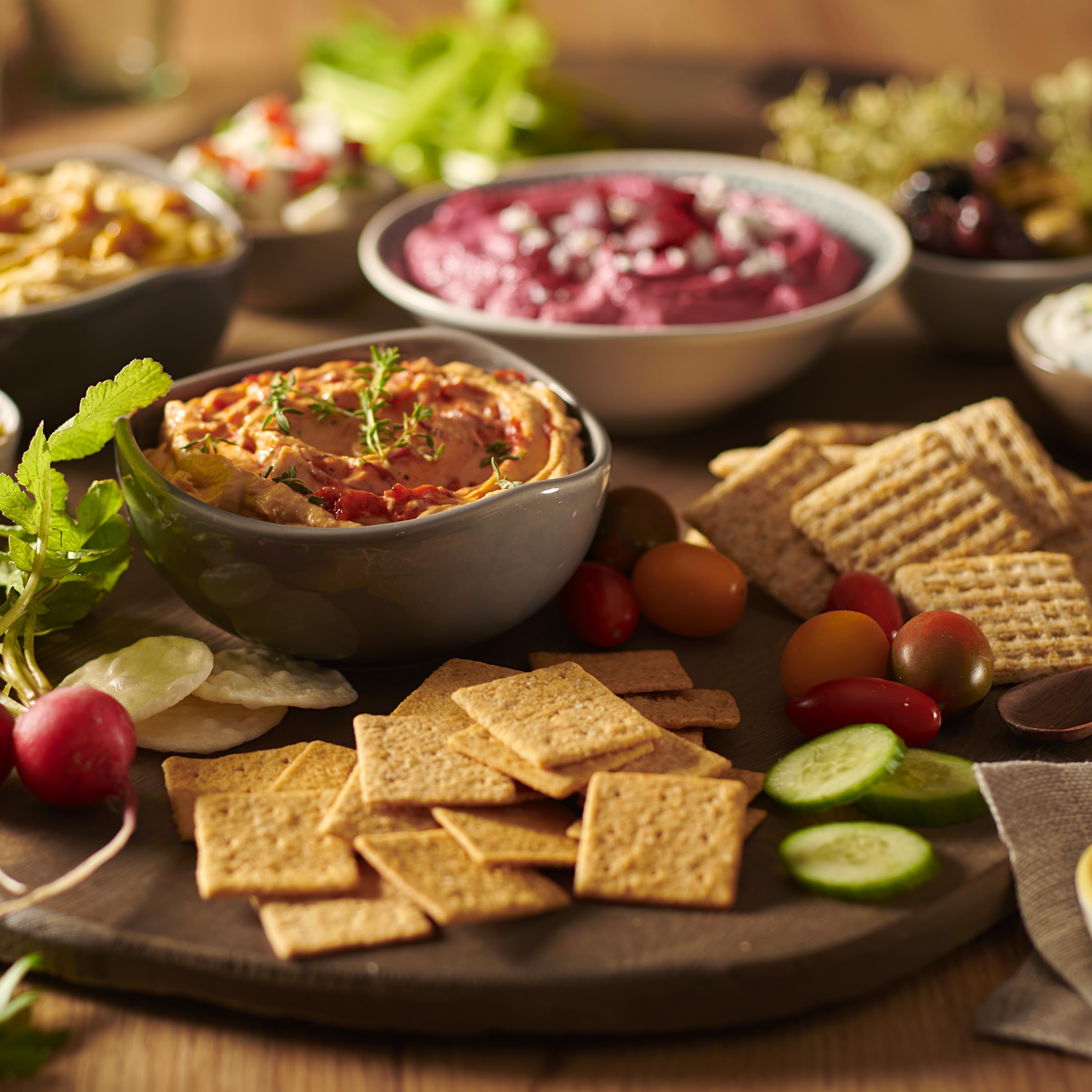 Triscuit and Wheat Thins on charcuterie board offering pairing ideas and entertaining ease