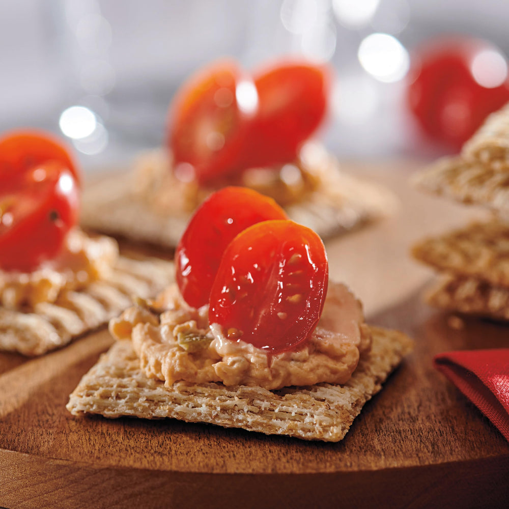 Crackers beside a ruler for serving size and portion comparison to plan snacks