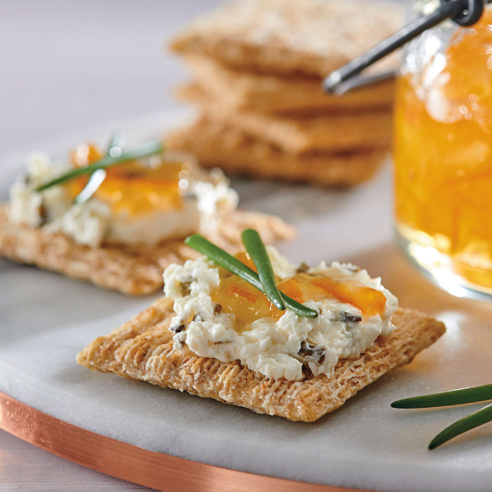 Triscuit crackers served with hummus demonstrating pairing versatility