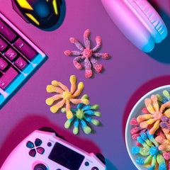 Trolli gummies next to a hand for size comparison demonstrating single-piece portion
