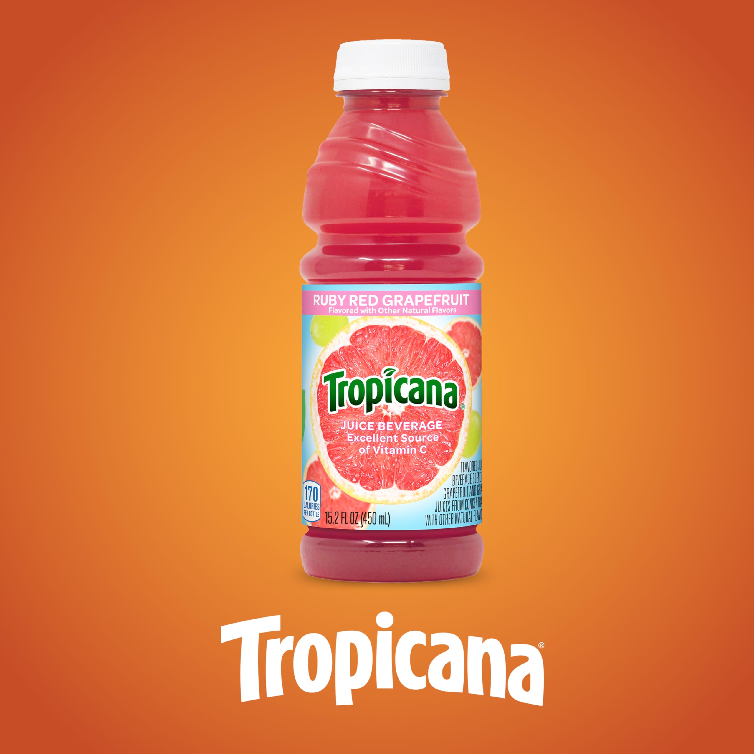 Tropicana Ruby Red bottle next to an apple showing 15.2 fl oz size scale