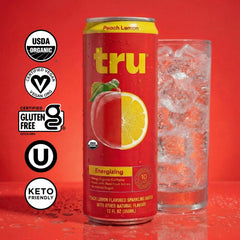 Tru being poured into a glass to show clarity and natural fruit color
