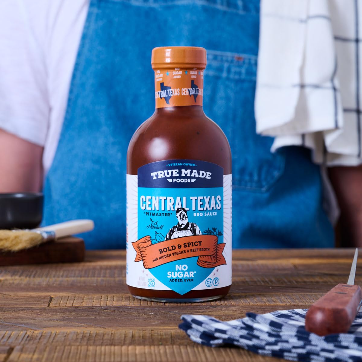 True Made Foods open cap with drip showing pour control and richness