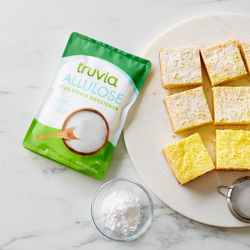 Truvia pouch next to measuring cup showing 17 oz size and portion guidance