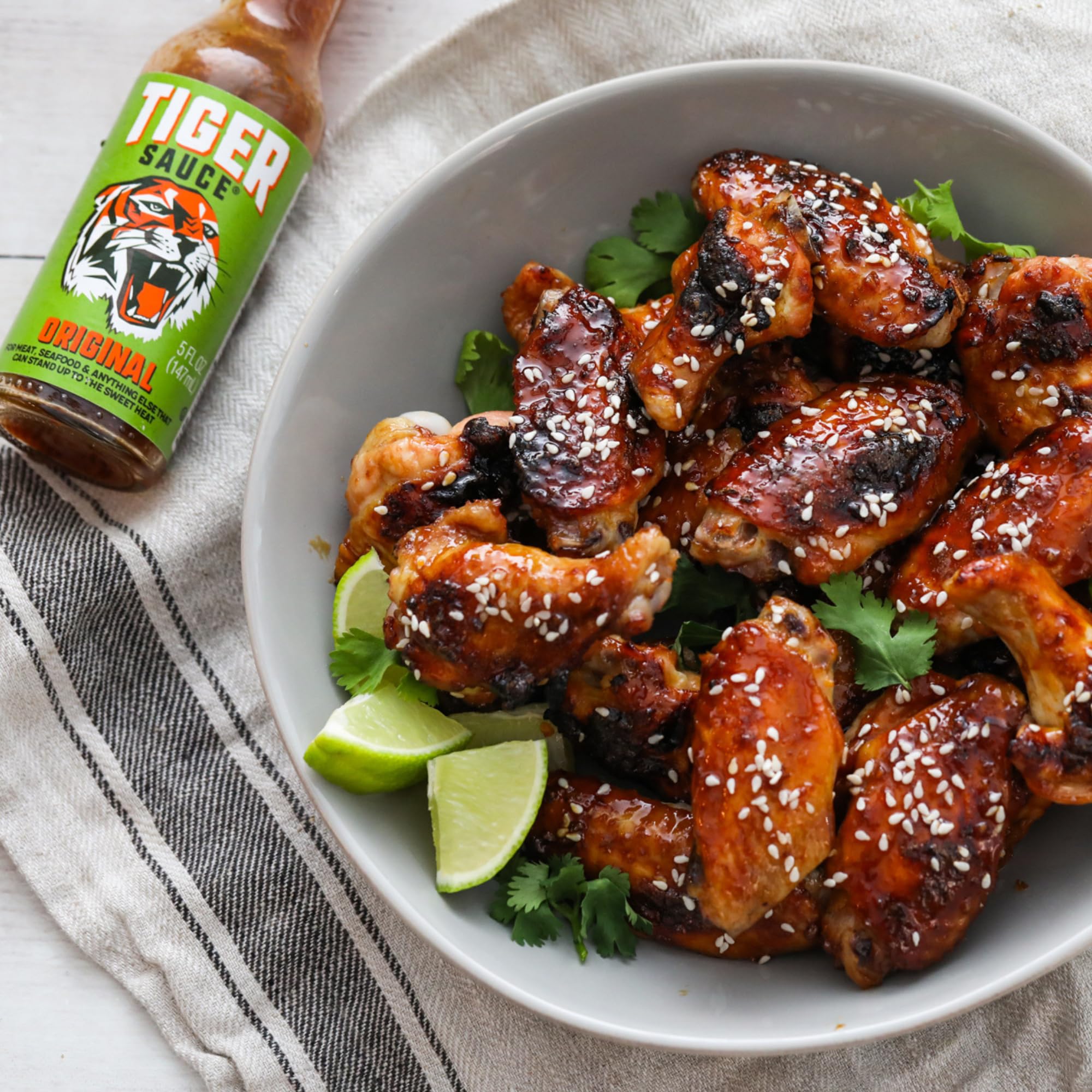 Try Me Tiger Sauce in a kitchen setting with meal prep, inspiring everyday culinary use