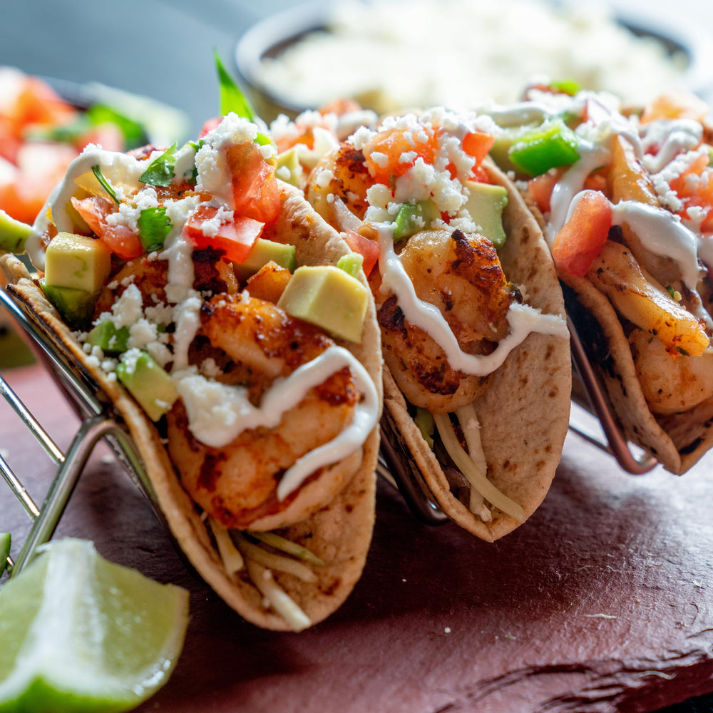 Try Me Yucatan Sunshine on tacos in a casual meal setting adding bright spicy flavor