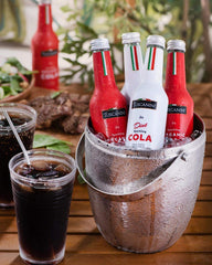 Tuscanini pouring cola into a glass, refreshing fizz and great-tasting pour