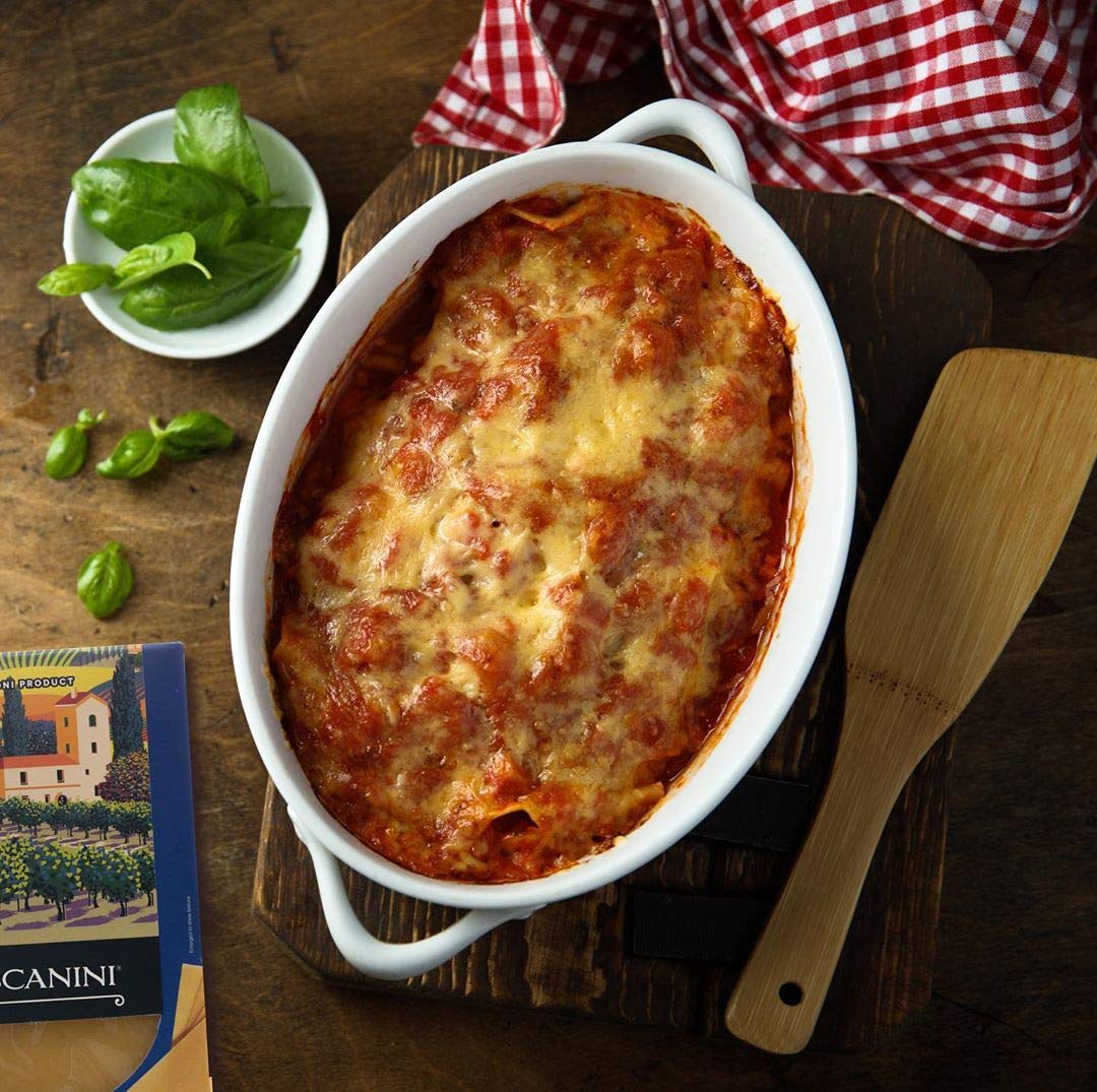 Tuscanini lasagna sheet held in hand for scale showing portion size and practical pack quantity
