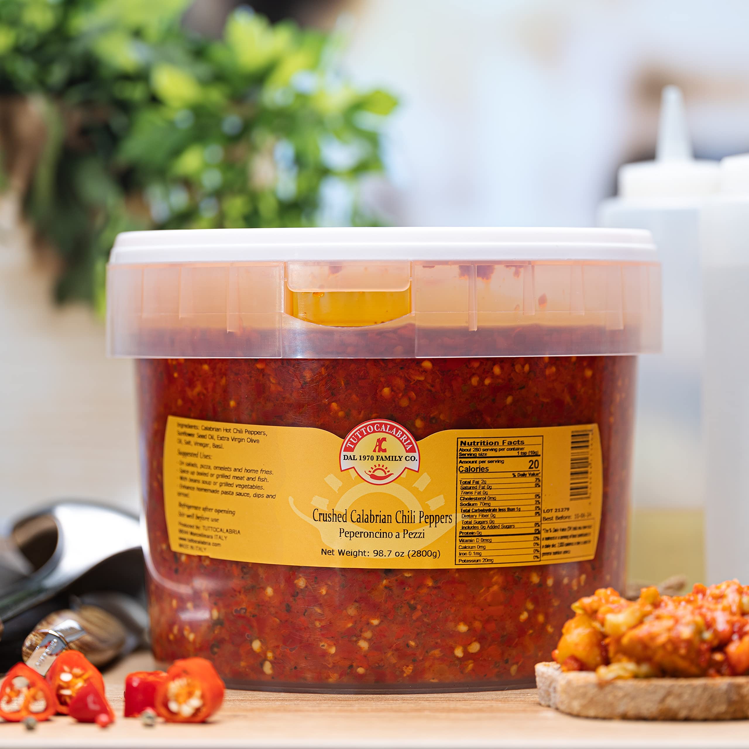 TUTTOCALABRIA used as pizza topping in kitchen scene adding bold Calabrian flavor benefit