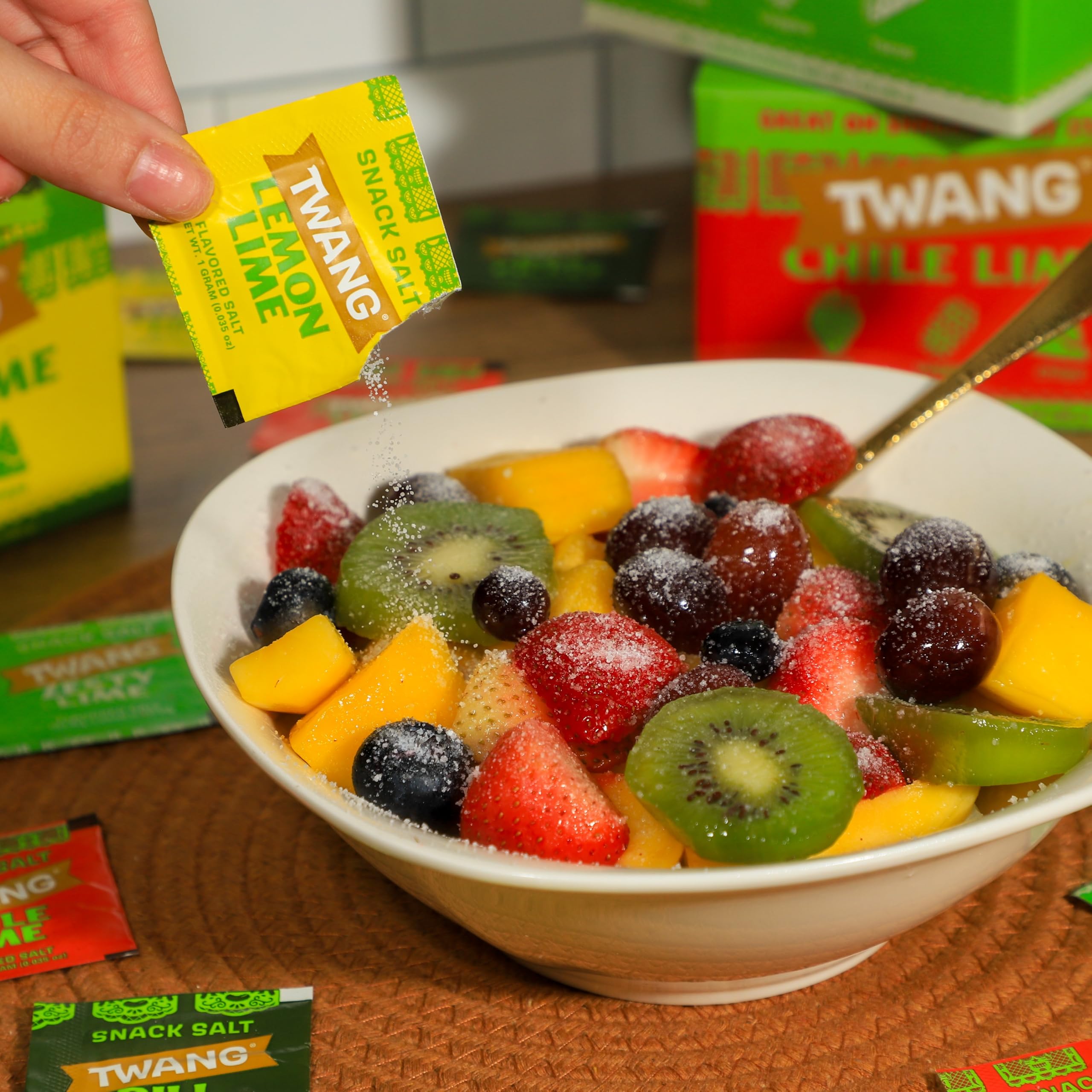 Twang pack of 200 beside a ruler to show compact single‑serve 1g scale