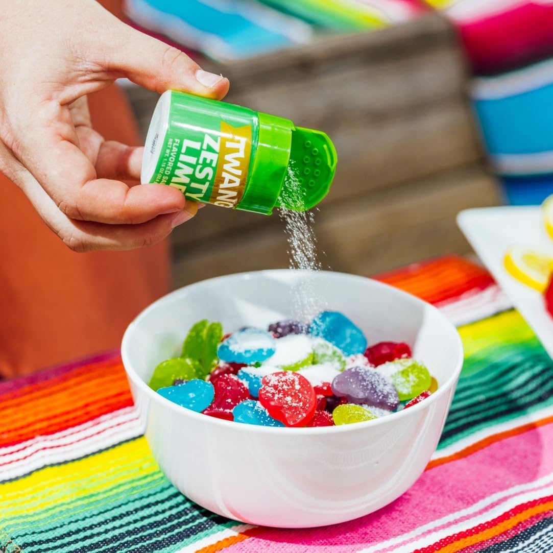 Twang lime sprinkled on popcorn adding zesty flavor to snack with vibrant benefit