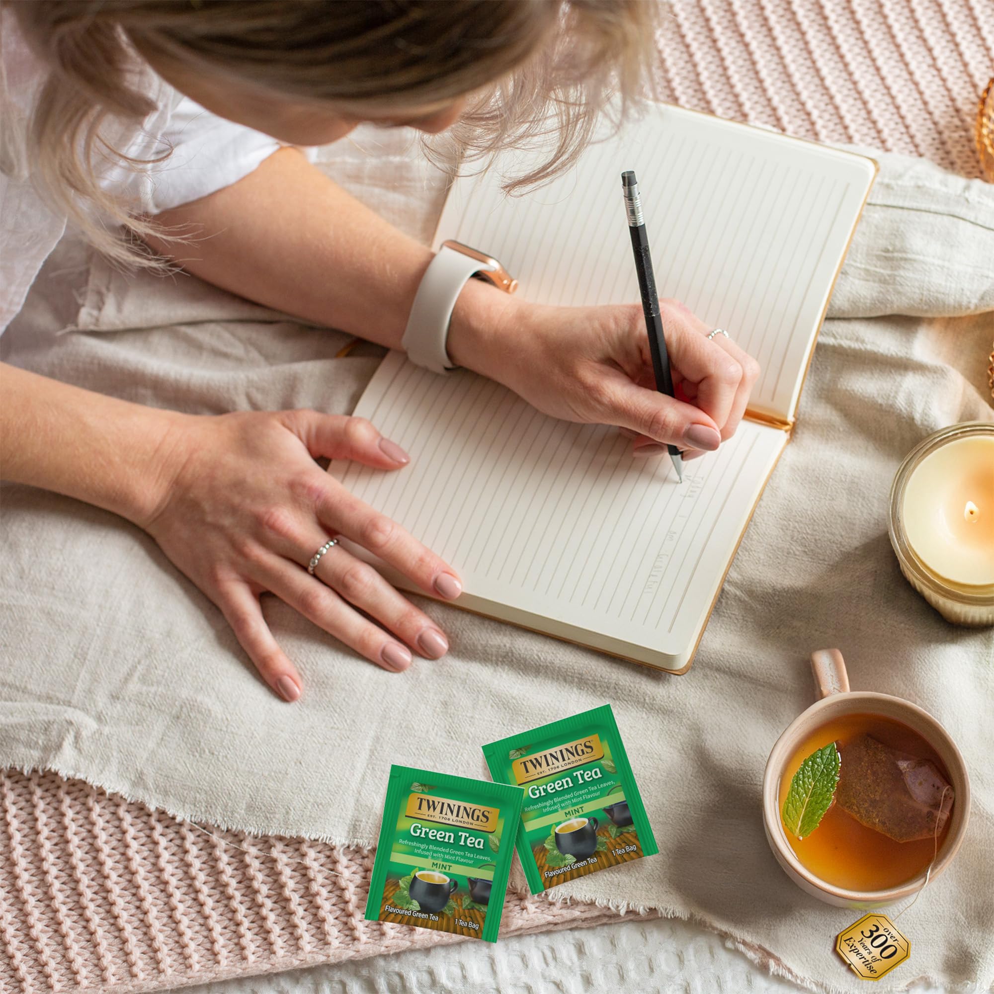 Twinings brewed green tea in cup with mint garnish for refreshing taste