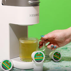 Opened Twinings pod revealing tea contents and quick-brew convenience