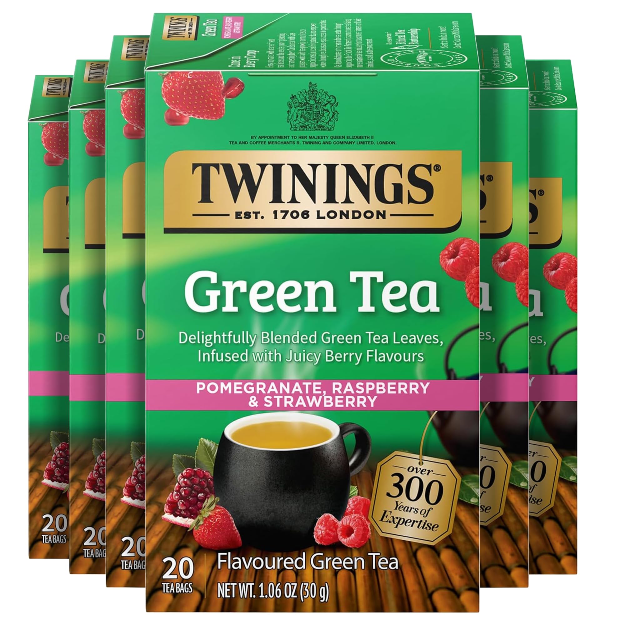 Twinings front packaging showing green pomegranate raspberry and strawberry flavors and clear labeling benefit convenience