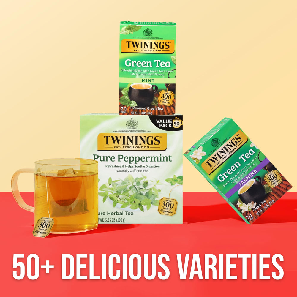 Twinings tea box beside coffee mug showing compact size and portability