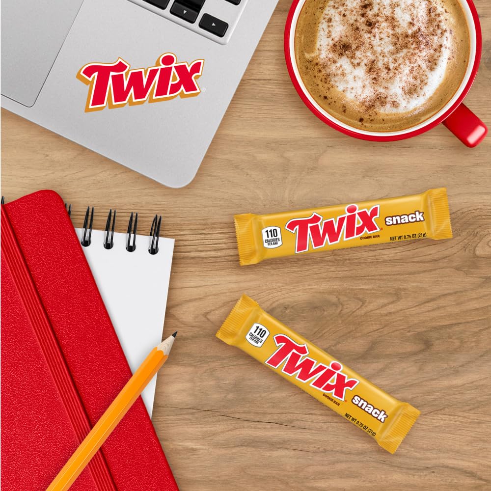 TWIX cookie cross section revealing crunchy cookie, caramel, and chocolate layers