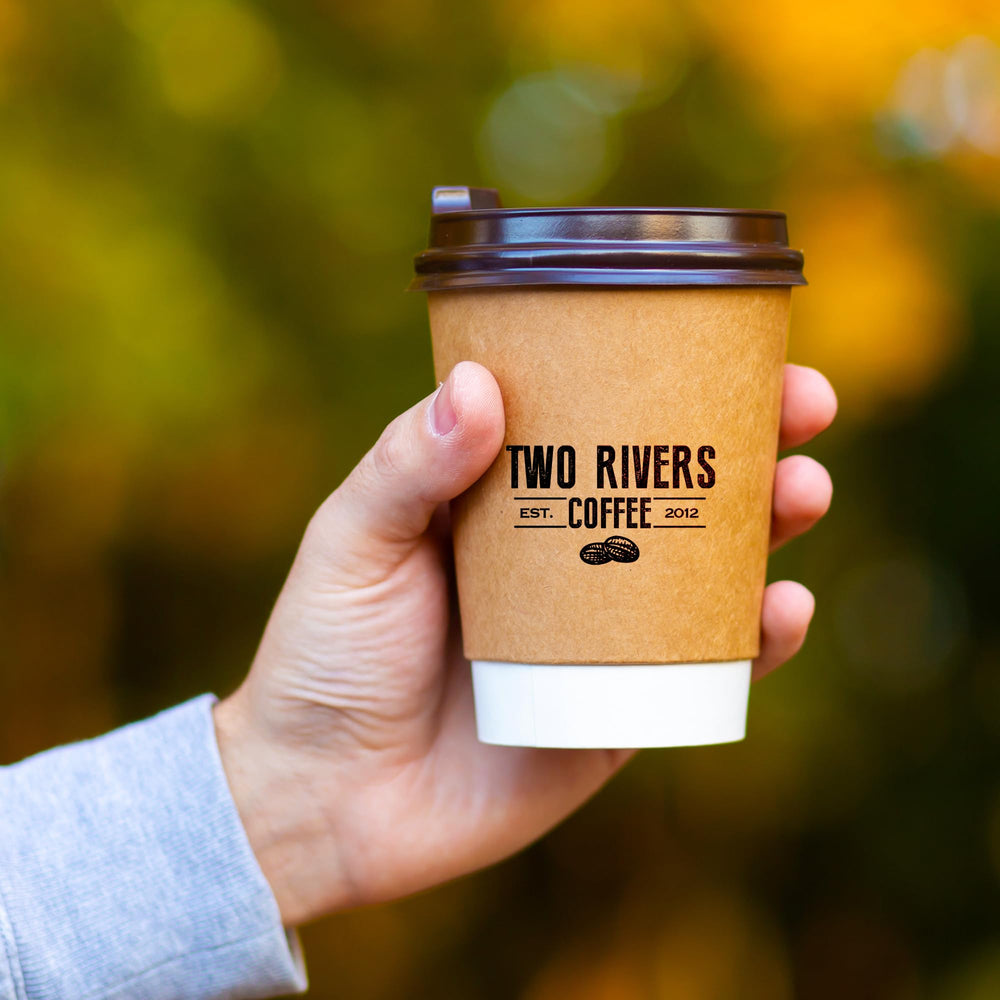 Two Rivers Coffee K-Cup beside standard mug to show true scale