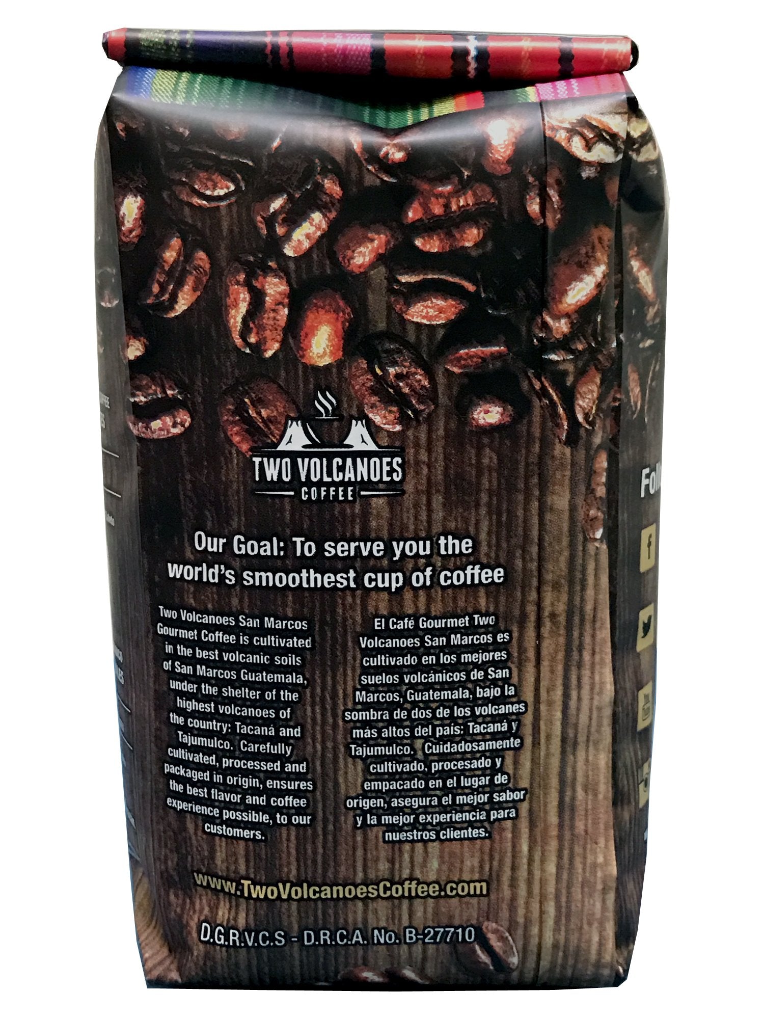 Two Volcanoes beans held in hand to show bean size and roast uniformity for quality