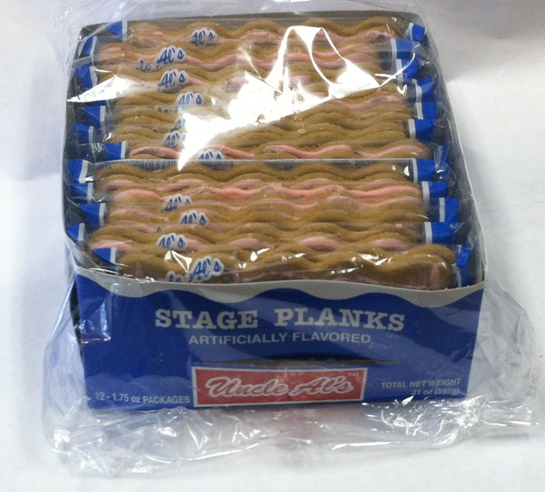 Uncle Al's plank smoldering on a stage tray demonstrating low-smoke benefit