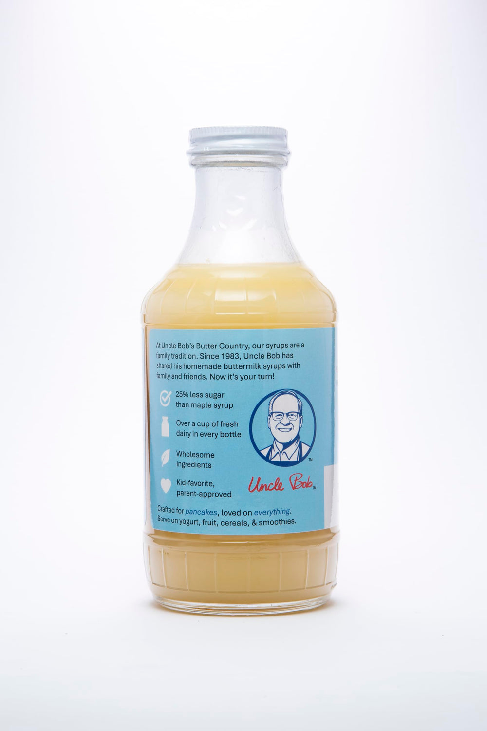 Uncle Bob's Butter Country bottle next to spoon showing 16 fl oz scale and portioning benefit