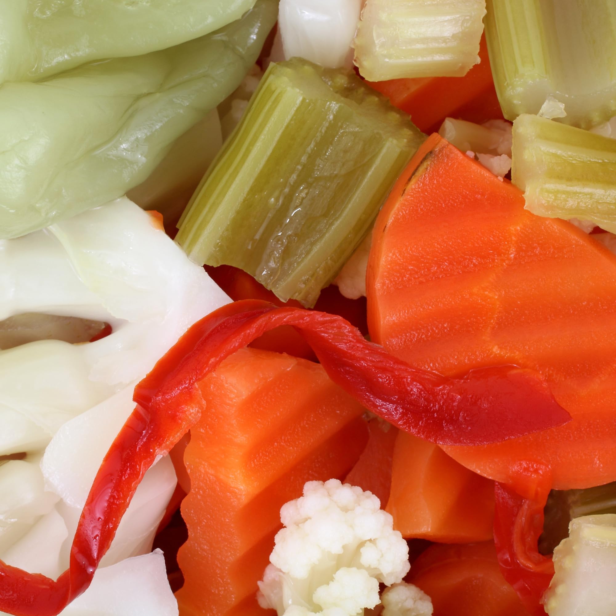 Uncle Giuseppe's open jar showing brine and packed vegetables emphasizing freshness