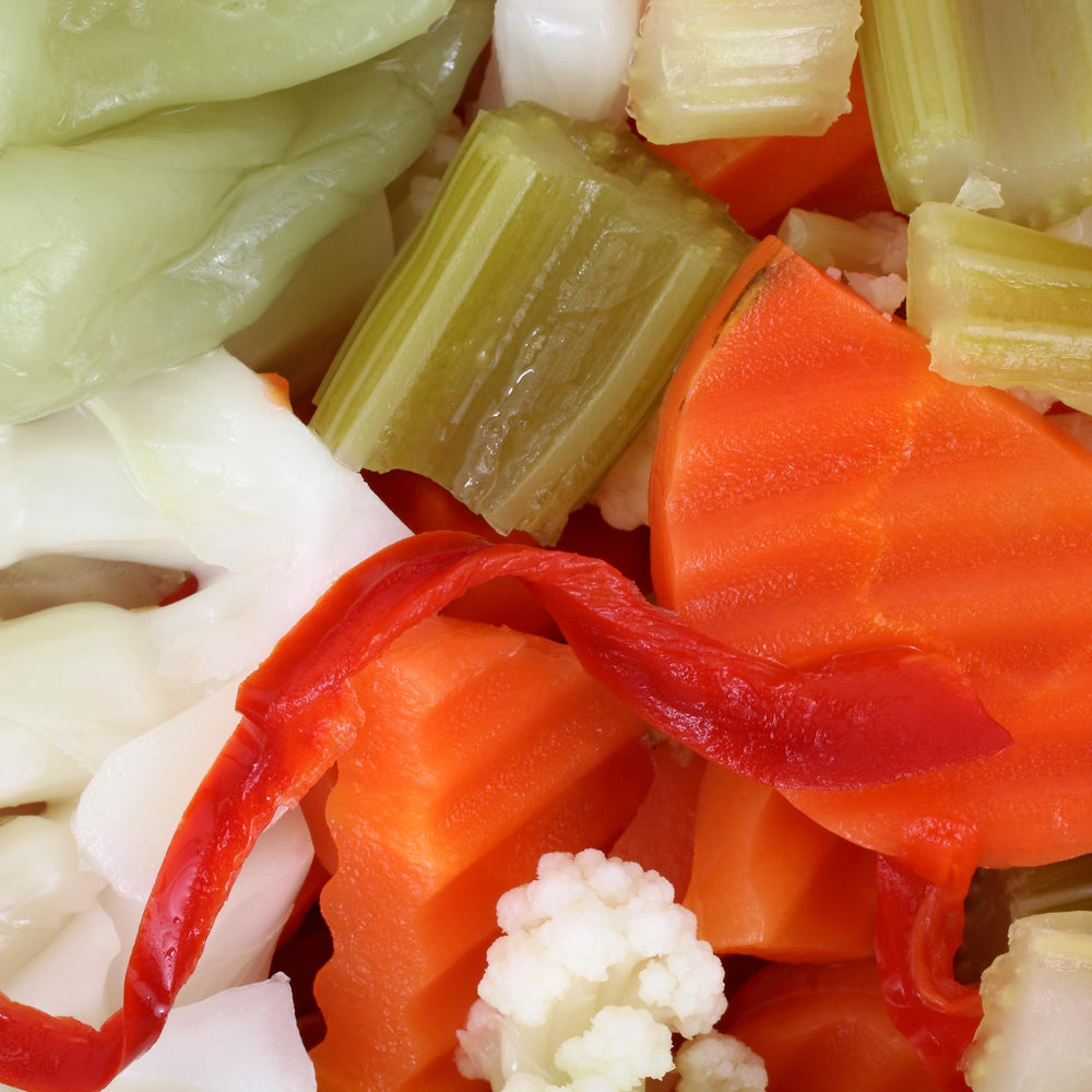 Uncle Giuseppe's open jar showing brine and packed vegetables emphasizing freshness
