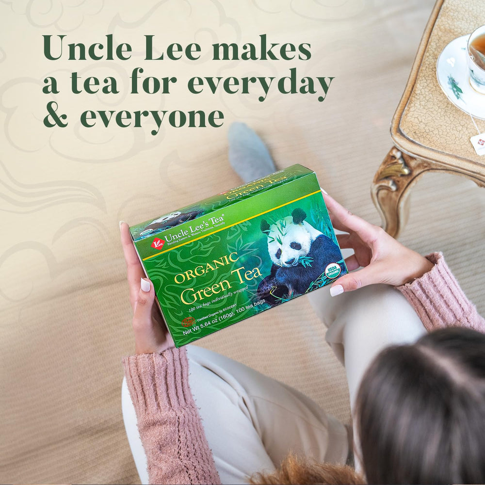Uncle Lee's Tea brewed cup top view showing clear pale green color and aroma