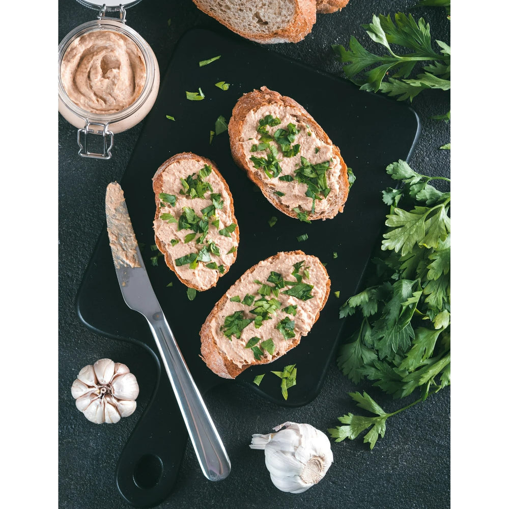 Underwood open can with spread on a knife ready to apply for quick sandwiches